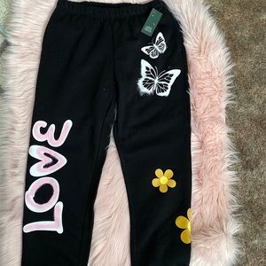 Brand new black sweats with side pockets size large great condition.